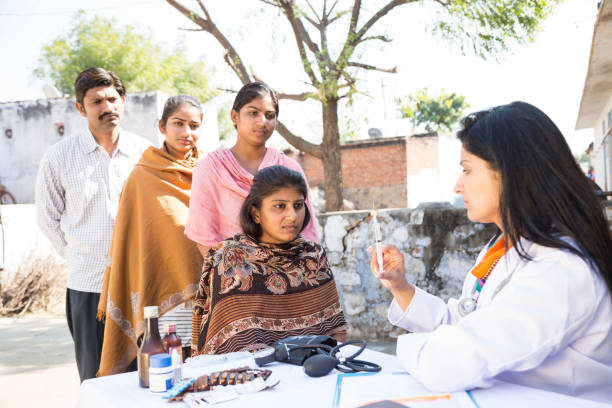 Doctor providing an outdoor community health consultation