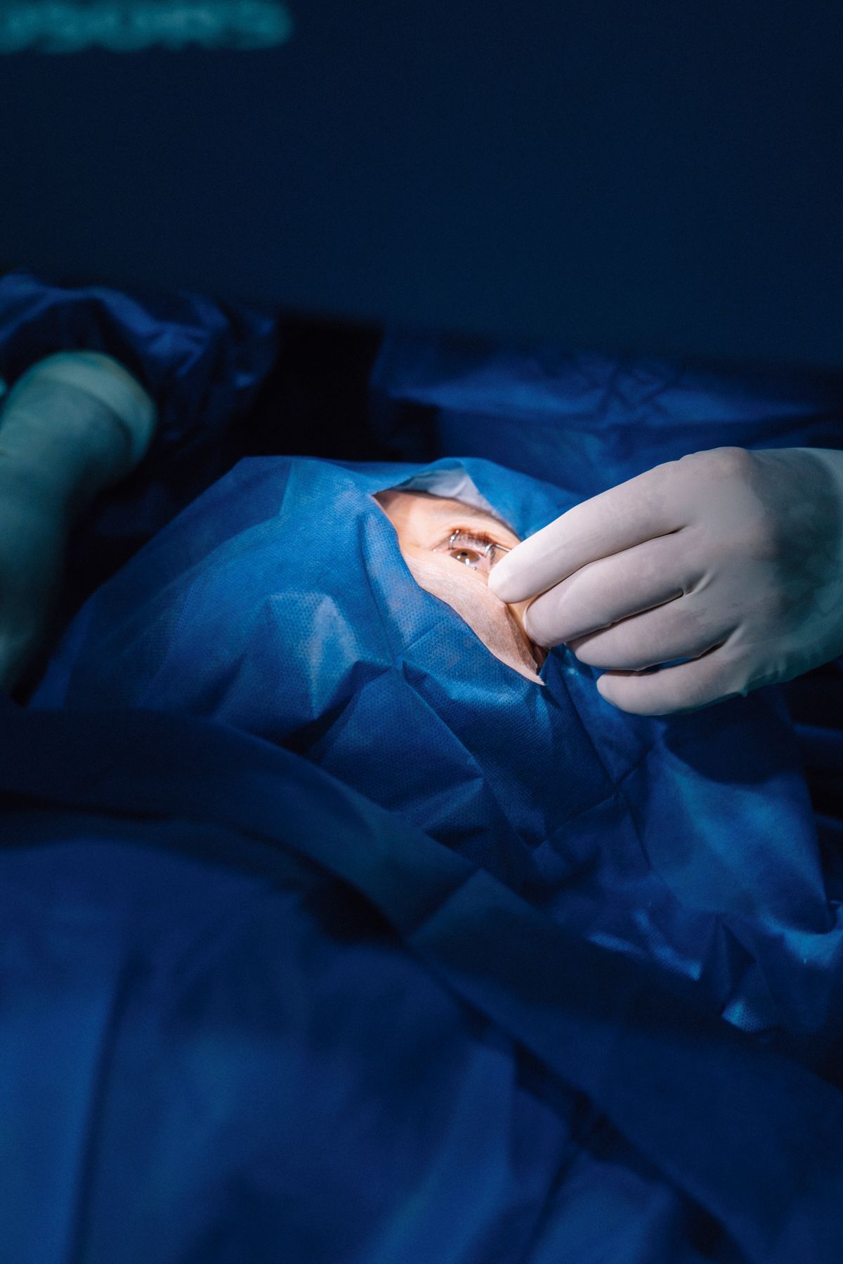 Ophthalmic surgeon performing an eye procedure