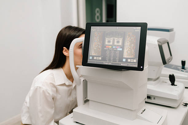 Patient undergoing optical coherence tomography eye scanning